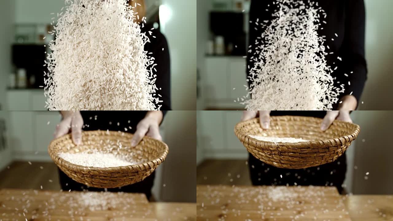 SLO MO女人在柳条碗里筛米