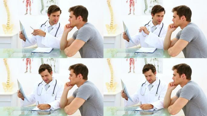 英俊的医生和他的病人讨论x光