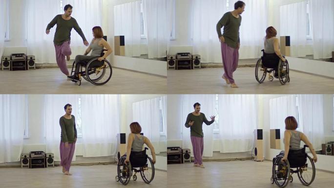 富有表现力的男人在工作室里与坐在轮椅上的截瘫女人跳舞