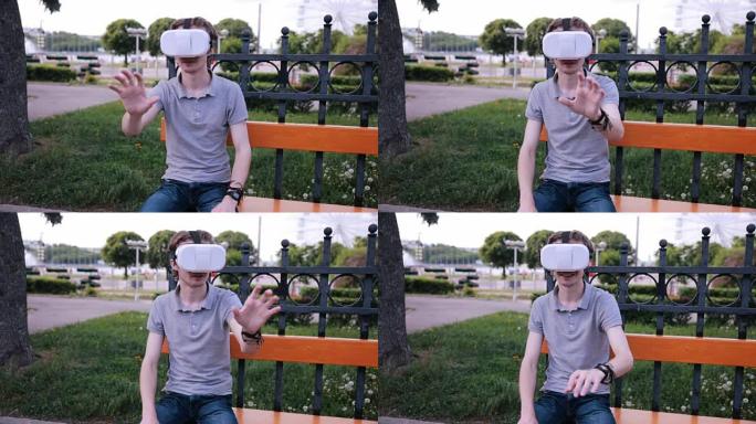 年轻人与3D VR头戴式显示器在公园看360电影，玩VR游戏