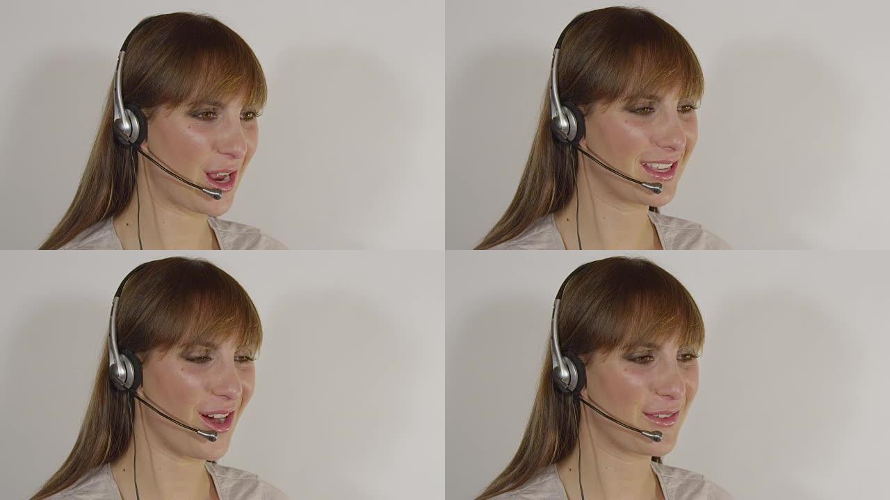 特写: 年轻的女性呼叫中心代理帮助客户解决问题。