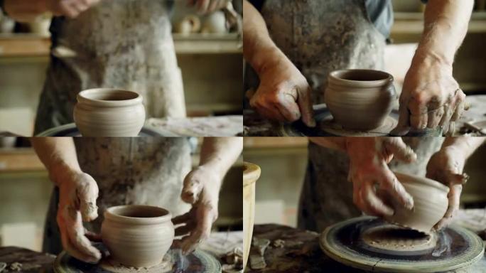 经验丰富的大胡子陶艺家正在使用专业工具从投掷轮上切割陶罐。创造传统的陶器和传统的陶器概念。