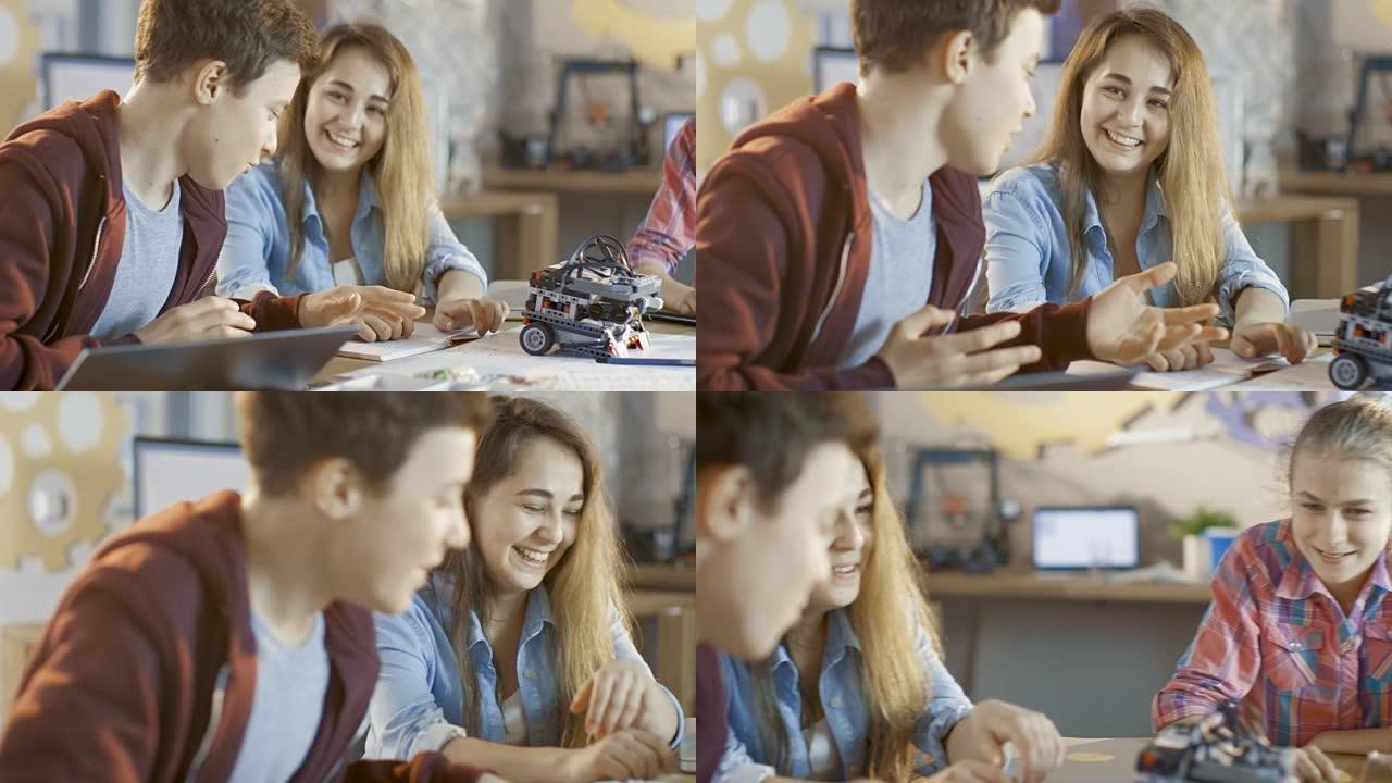 男孩和两个女孩在学校科学课项目上工作。他们画画，使用笔记本电脑和构建机器人技术。
