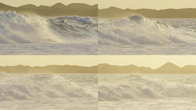 慢动作: 离岸风在橙色照明的日落时产生巨大的冲击波。