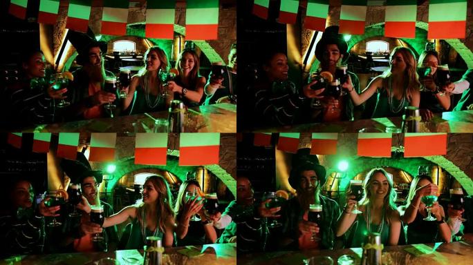 年轻的多民族朋友在爱尔兰酒吧庆祝圣帕特里克节