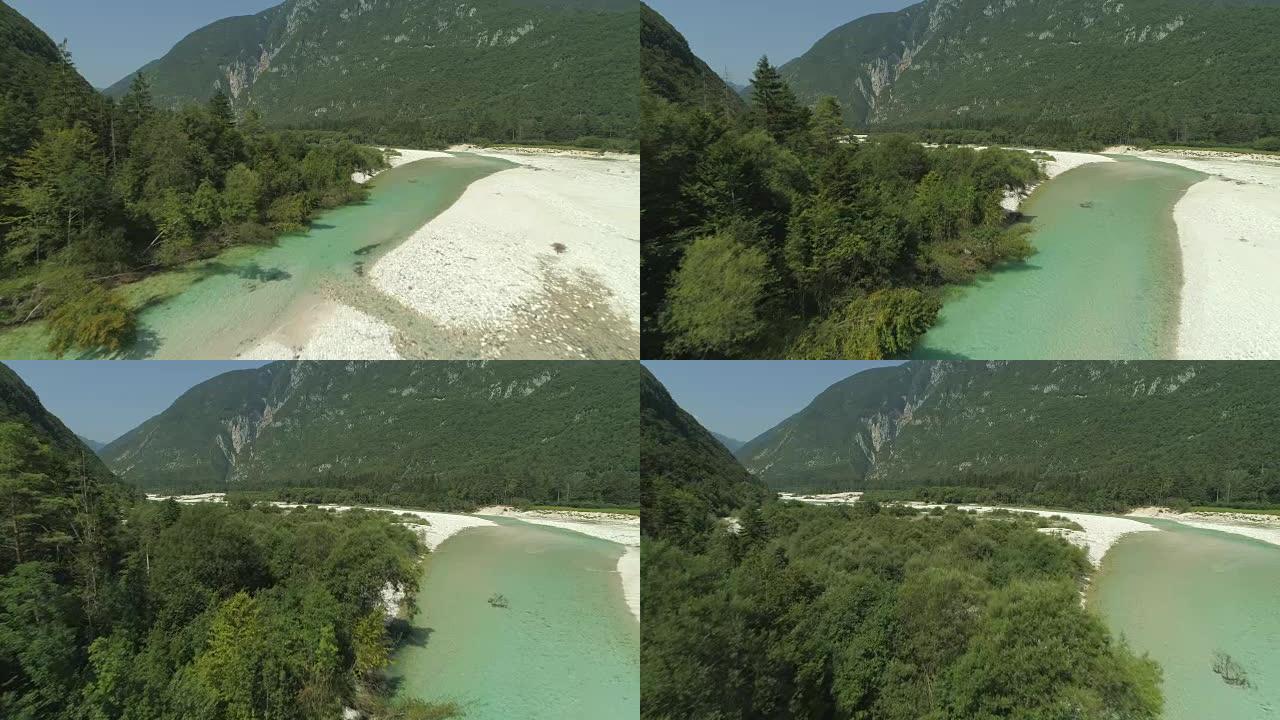 空中: 翡翠河在夏天坐落在美丽的绿色山谷中