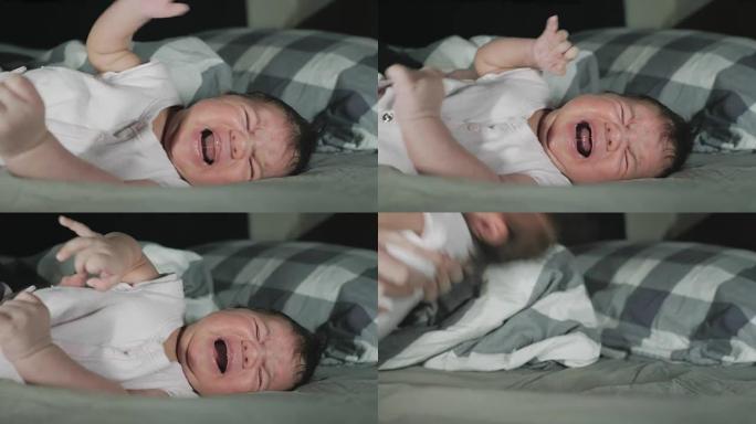 母亲抱起哭泣的新生婴儿的特写镜头。
