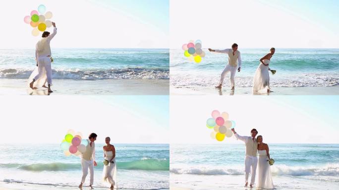 新婚夫妇在海滩上笑着玩气球