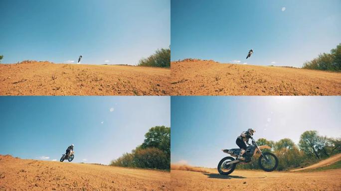 摩托车骑手跳跃后的慢动作着陆