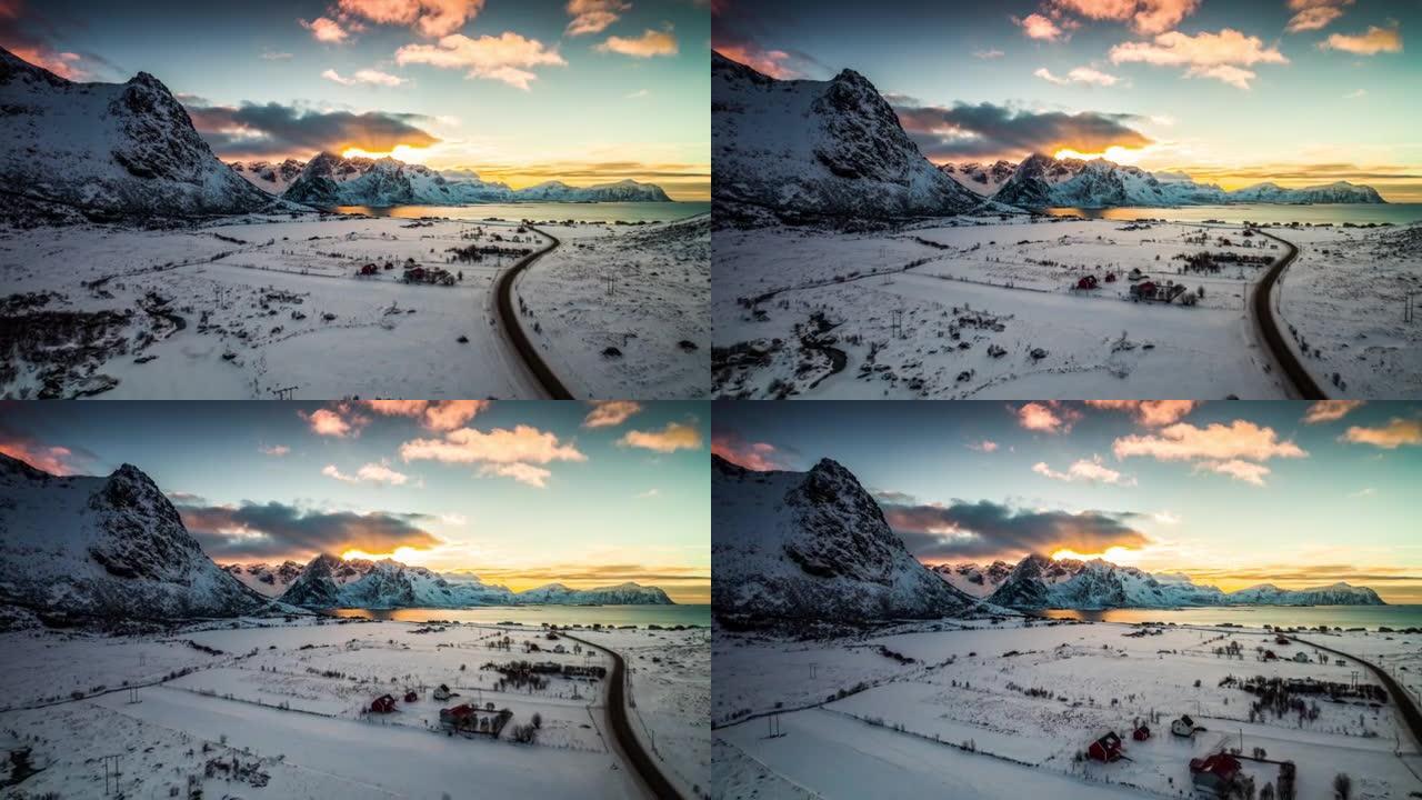 挪威罗弗滕群岛喜怒无常的日落天空下的北欧冬季景观飞行