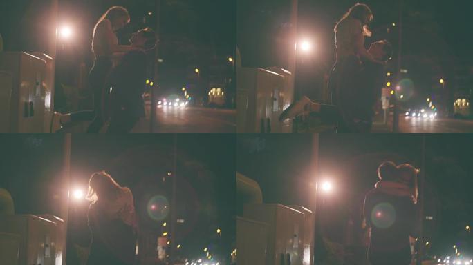 晚上与一对相爱的情侣约会的城市街道