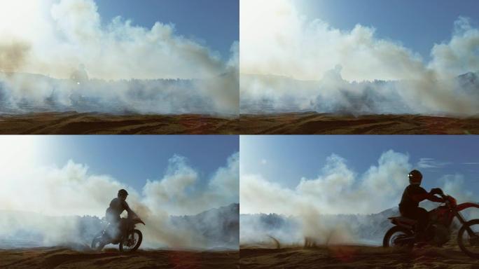 专业的摩托车越野赛FMX摩托车骑手在烟雾弥漫的泥土路上行驶。