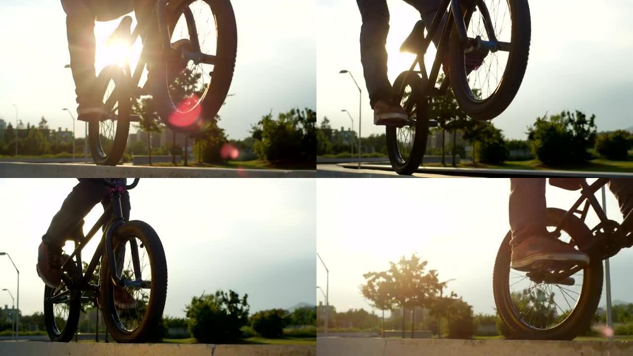 慢动作特写: Bmx自行车手在混凝土长凳上的后轮上骑车轮
