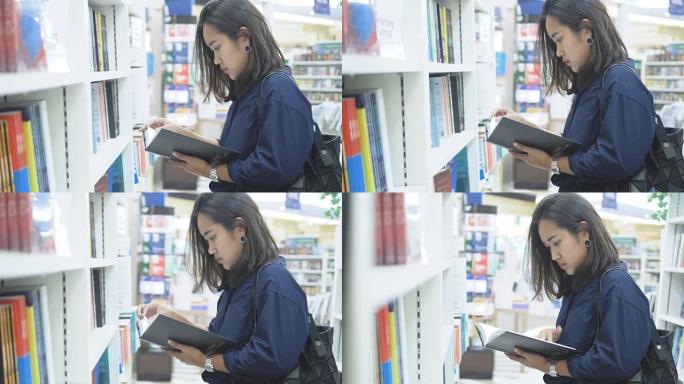 亚洲妇女在书店选书