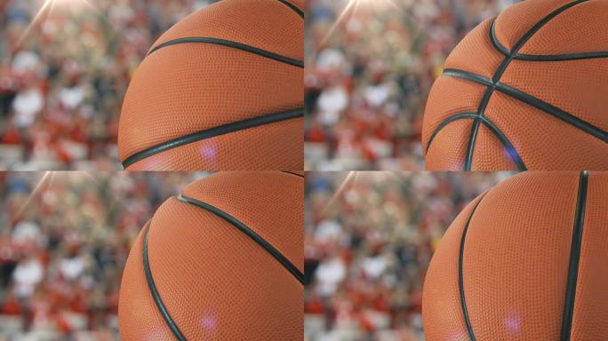 美丽的篮球旋转特写镜头在体育场背景下慢动作。回环篮球3d动画的转球。4k UHD 3840x2160