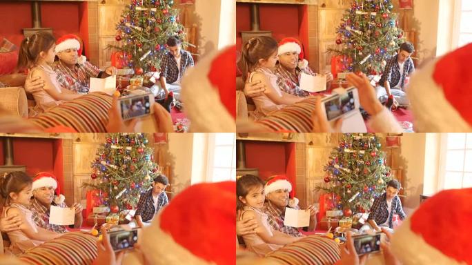 在圣诞节拍摄家庭开幕礼物和卡片的照片