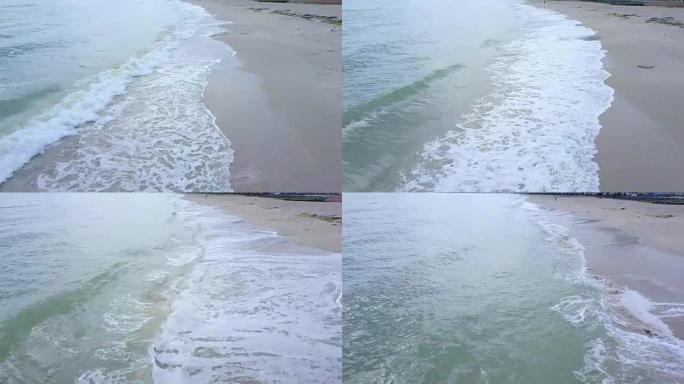 泰国宋卡萨米拉海滩的海岸线和波浪的4k无人机视图