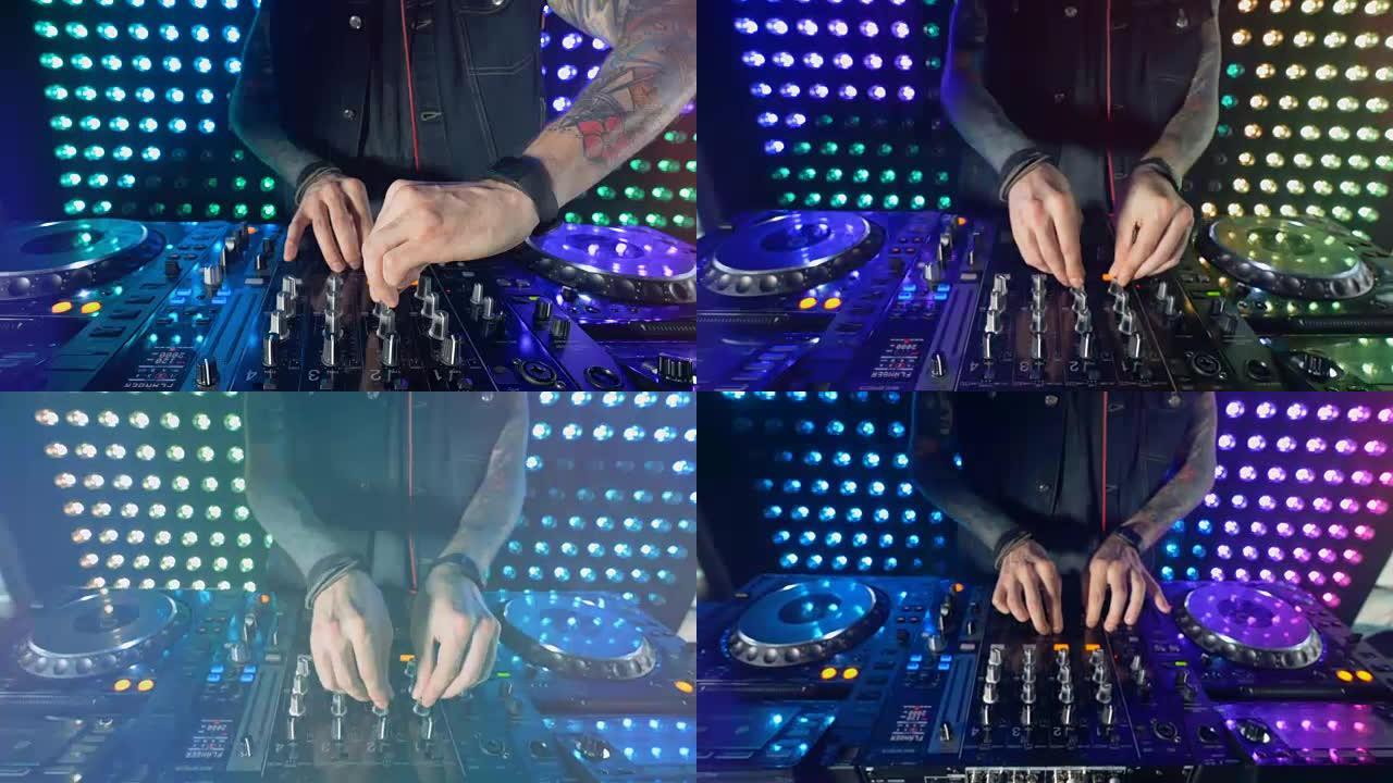 迪斯科和俱乐部DJ在夜总会派对上双手混合。