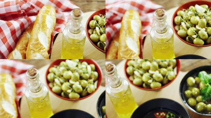 餐桌上的面包，橄榄油和橄榄小吃