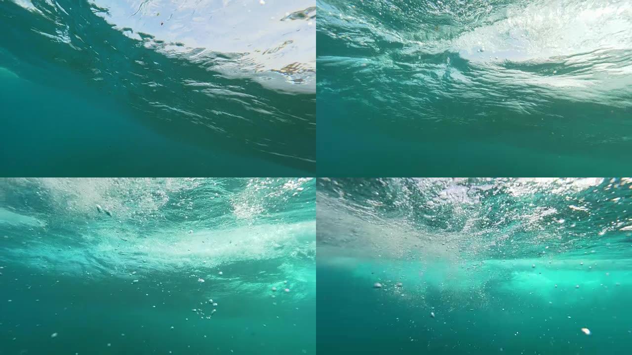 水下慢动作: 丰富的蓝海形成桶和大量气泡