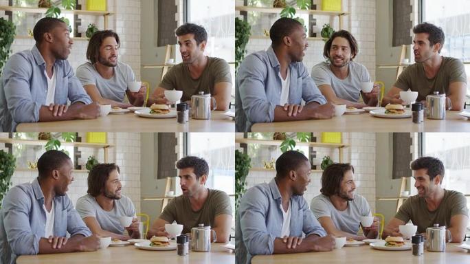 三个男性朋友在咖啡店见面慢动作拍摄