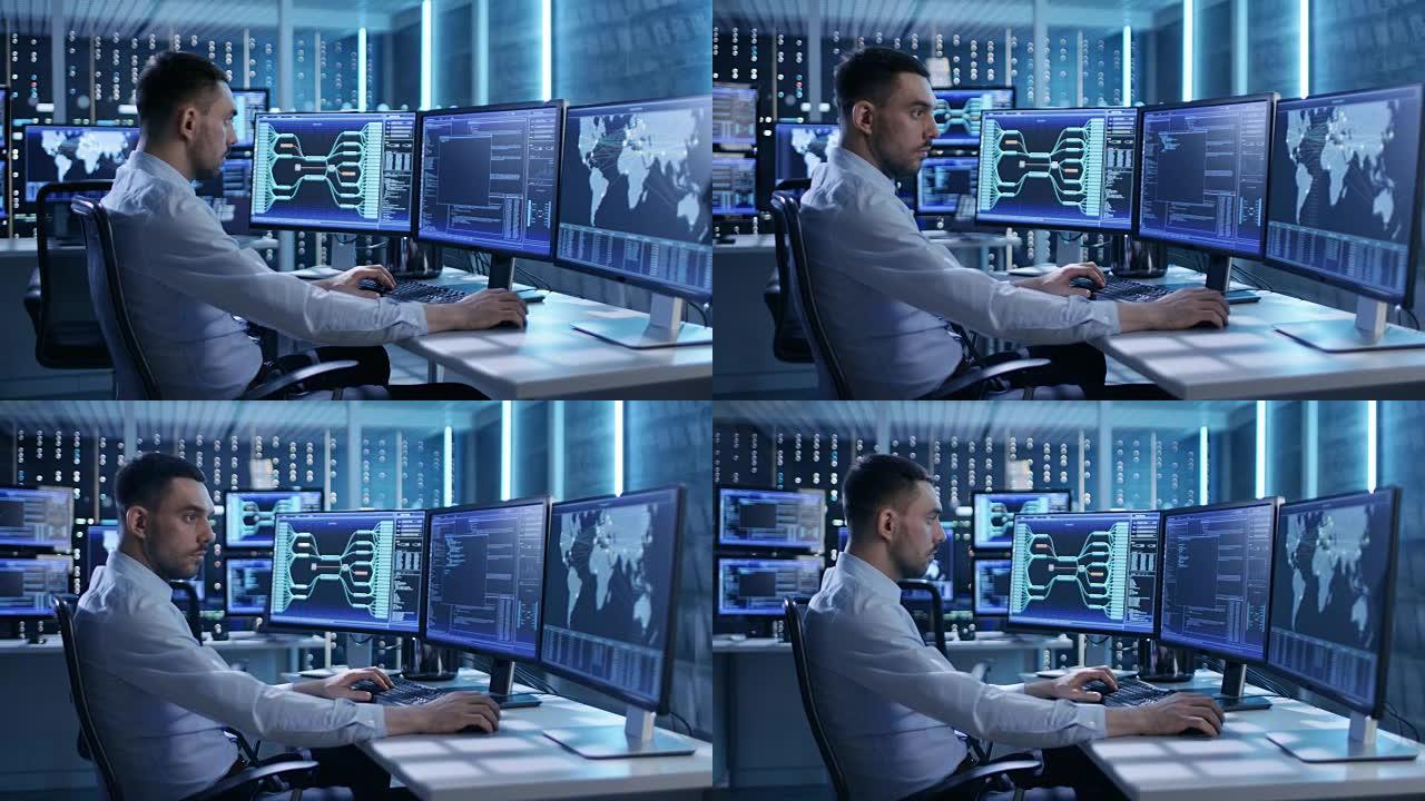 系统安全专家在系统控制中心工作。房间里满是显示各种信息的屏幕。他与同事分享他的意见。