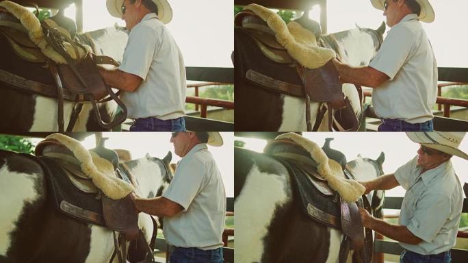 牛仔调整马背上的马鞍