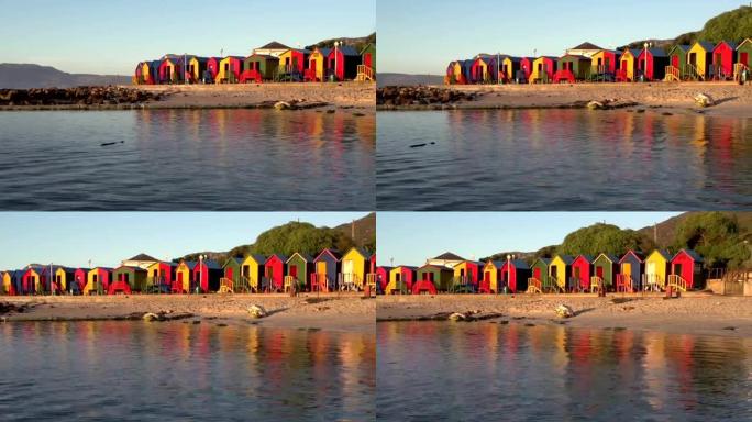 圣色彩鲜艳的更衣室和潮汐池的平移照片。开普敦詹姆斯海滩