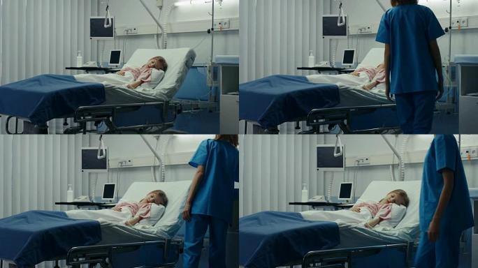 生病的小女孩躺在医院的床上。可爱的生病的孩子由现代儿科/儿童病房的护士照顾。