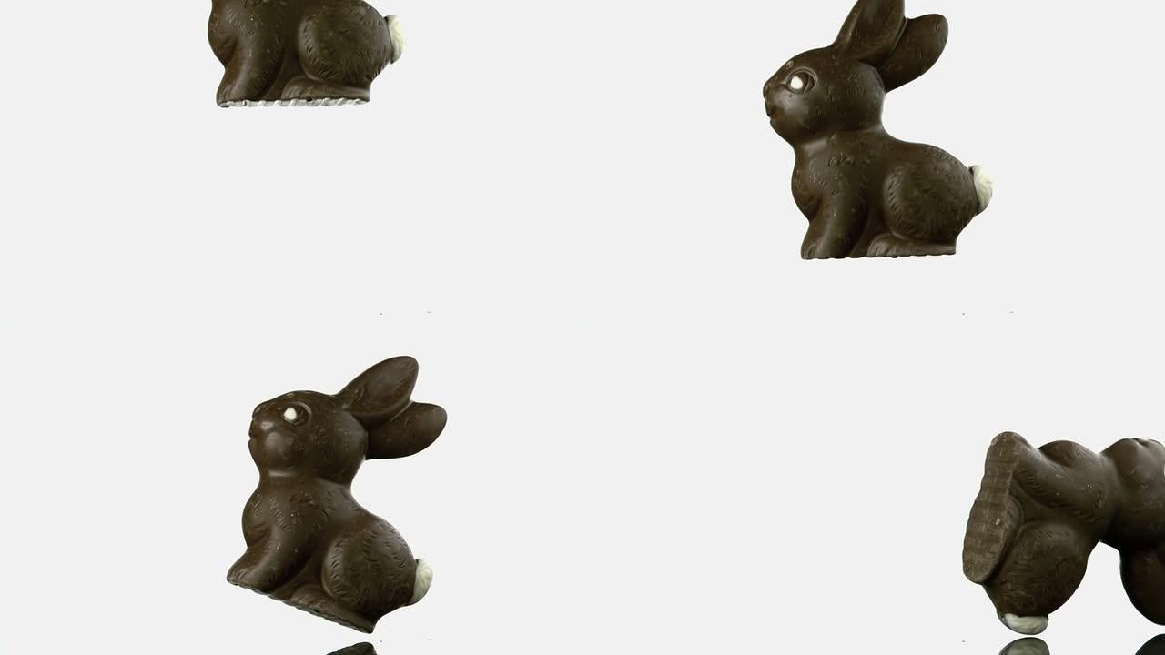 巧克力兔子掉落并弹跳到白色表面