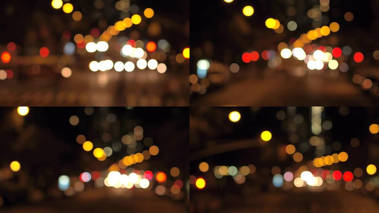 BOKEH: 夜间在纽约市五颜六色的模糊交通信号灯和抽搐的城市灯