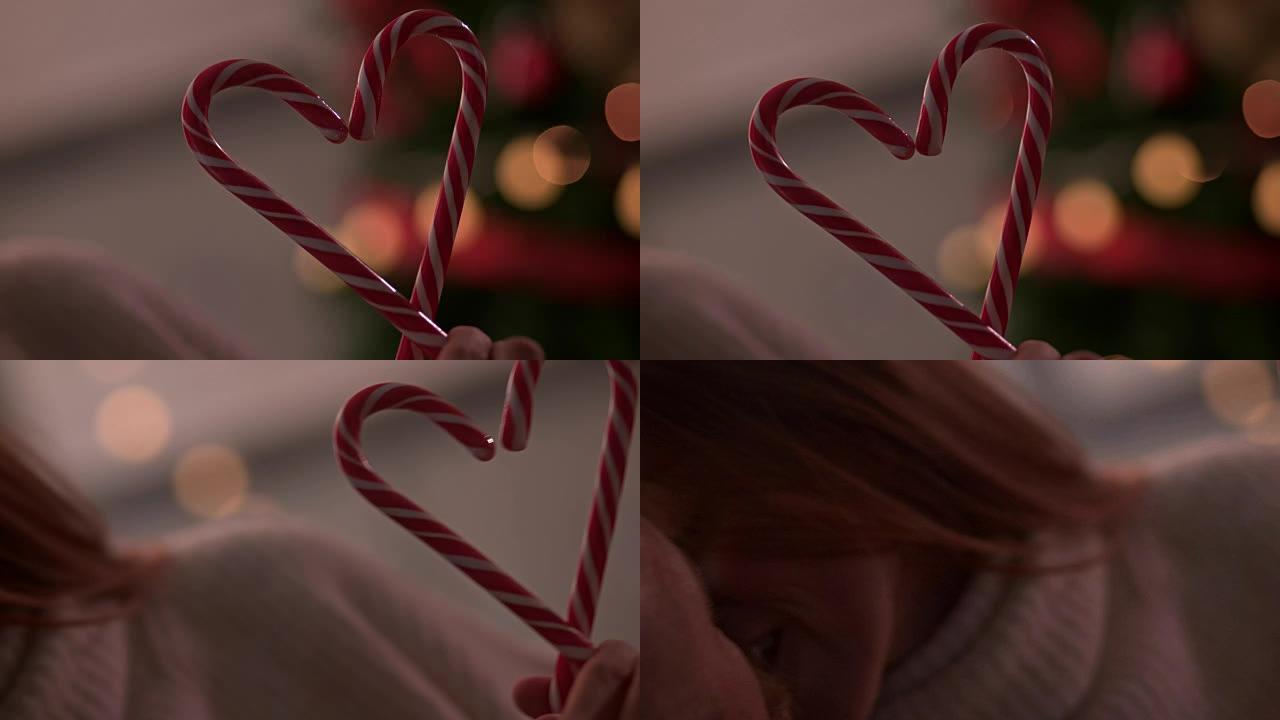 与拐杖在圣诞树前接吻的情侣