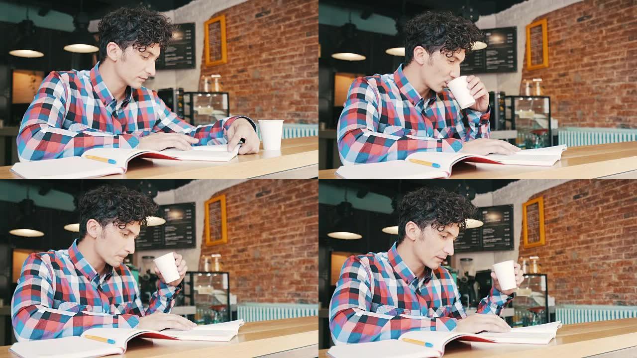 年轻人在咖啡馆看书。