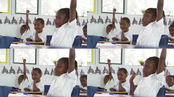 小学生在小学上课时举手