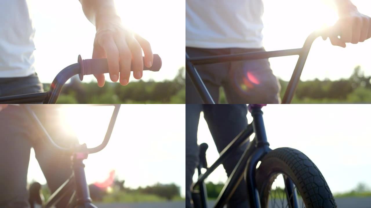 慢动作特写: 阳光透过bmx自行车手将手放在车把上