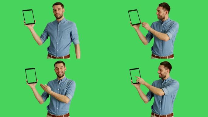一个时髦的男人用一只手拿着平板电脑，用另一只手滑动触摸手势。平板电脑和背景是绿色屏幕。