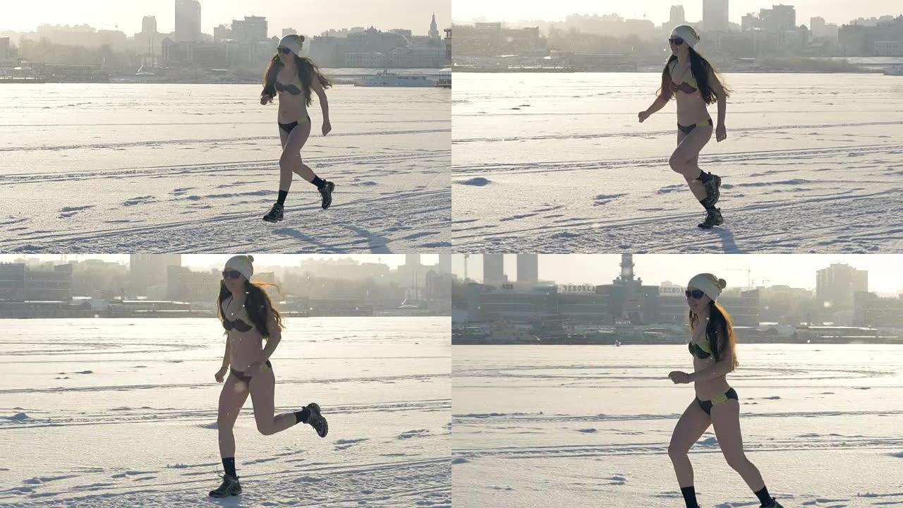 一个穿着靴子和比基尼的女人在冬天跑步。