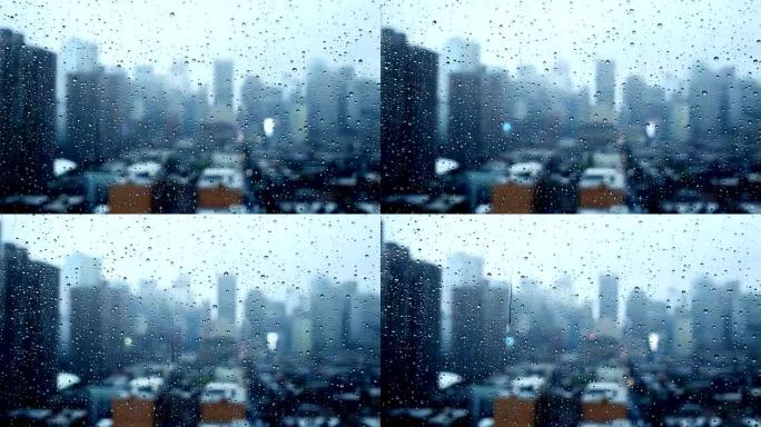 窗户上的降雨。城市的恶劣天气。
