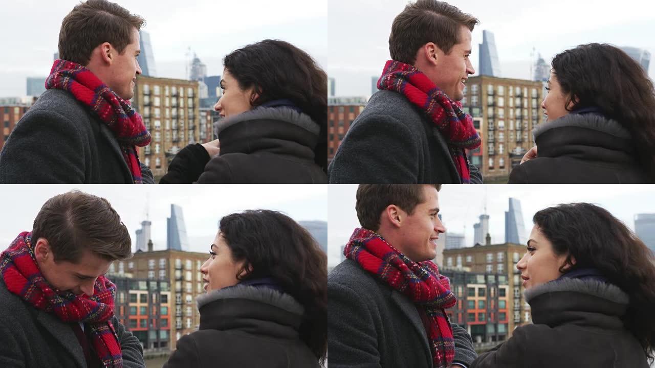 年轻的旅游夫妇在冬天访问伦敦