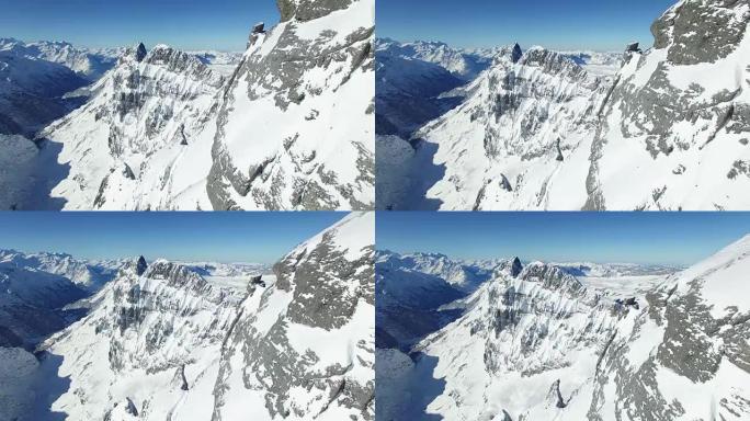 Establishing shot of snowy mountain top landscape 