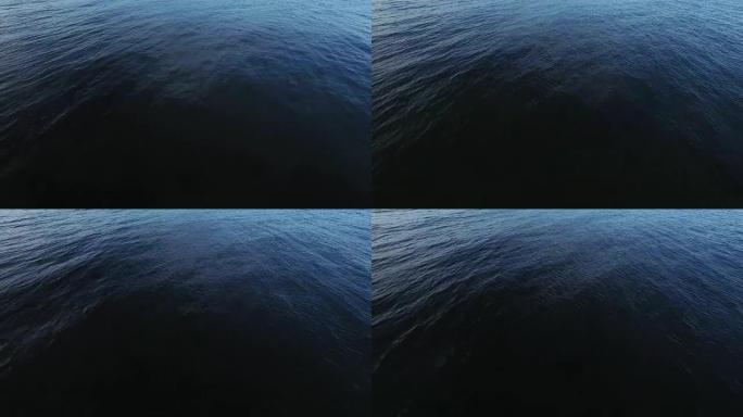 空中无人机在傍晚用光波拍摄大海。