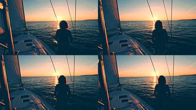 WS女人从帆船甲板上看着日落