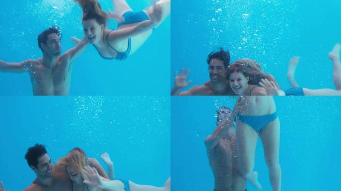 快乐的情侣在水下游泳
