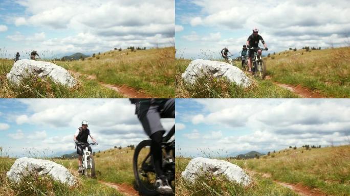 高清: 山地自行车手沿着乡村小径骑行