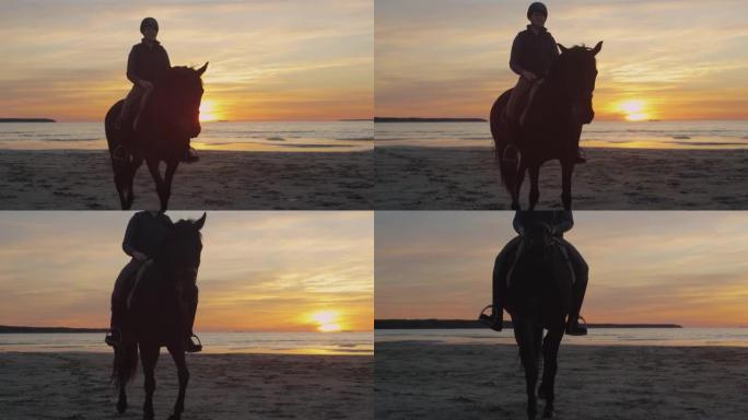 日落灯光下海滩骑马骑手的剪影。