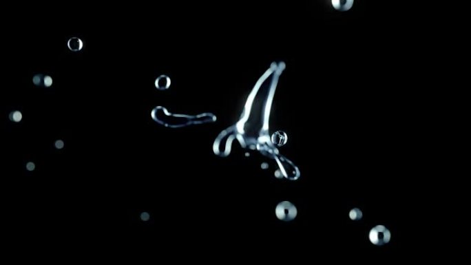 两个水滴碰撞飞溅黑色背景的Cg动画。