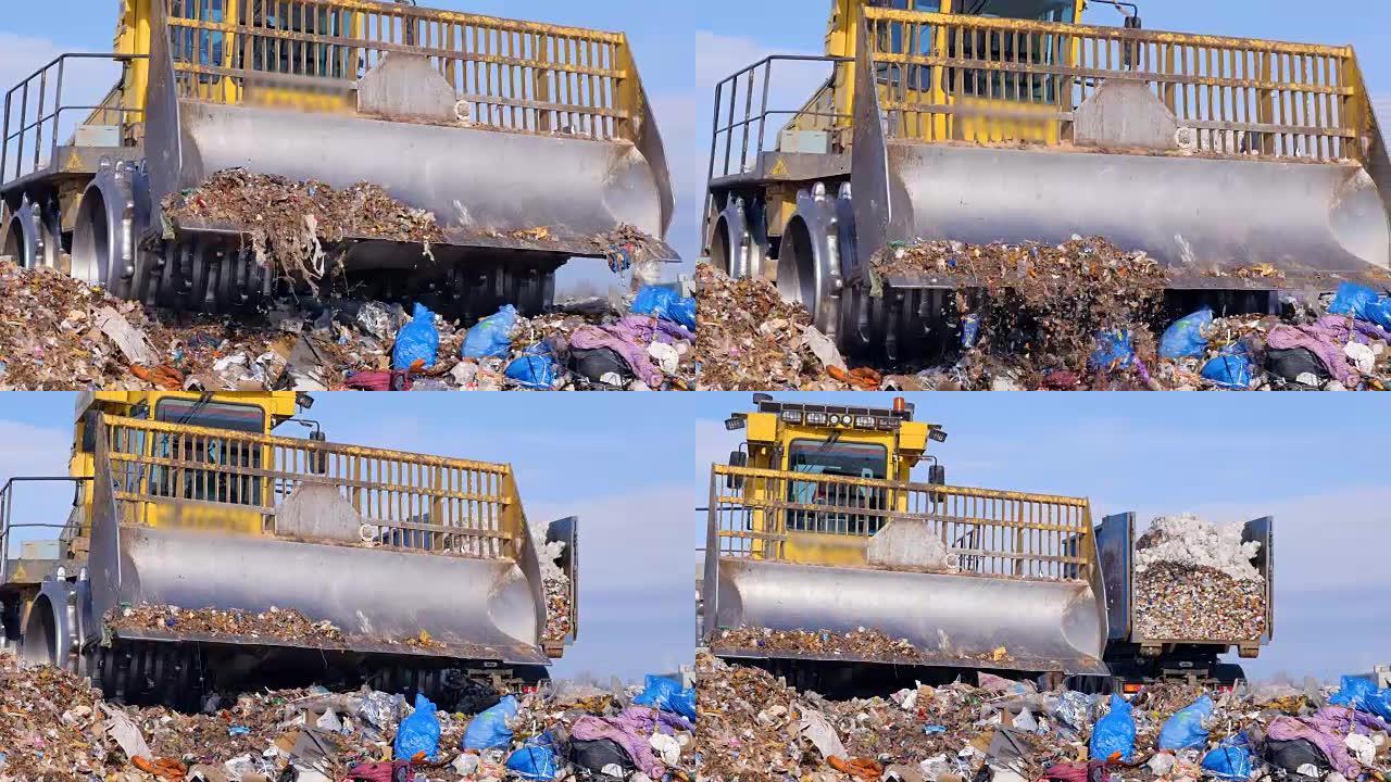 一辆满满的垃圾车附近的垃圾填埋场的近景。