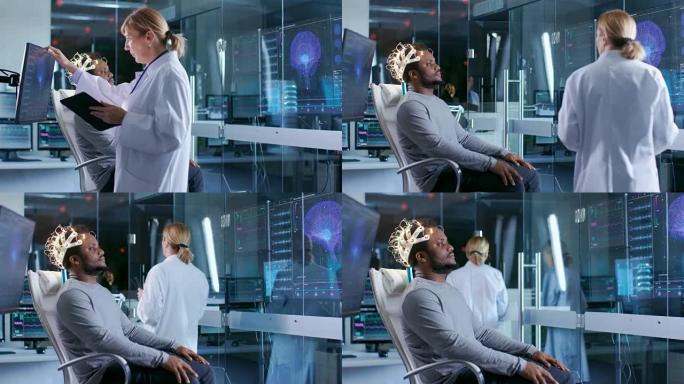 戴着脑电波扫描耳机的男子坐在椅子上，而科学家使用触摸屏显示器。在现代的大脑研究实验室监视器显示脑电图