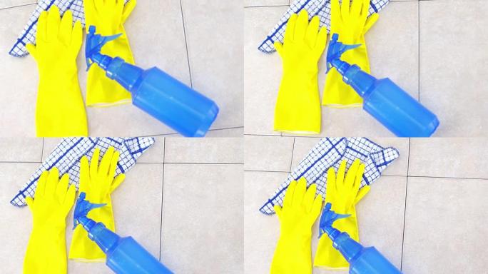 黄色橡胶手套和喷雾瓶