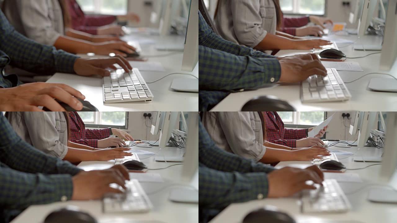 大学生在自习室使用计算机的特写